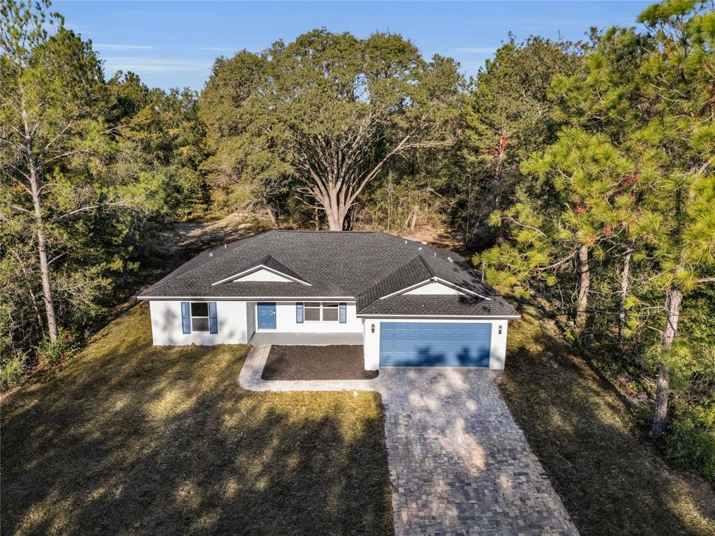 11790 Orange Road Ocklawaha, FL 32179 - Photo 21 of 21 a front view of a house with a yard