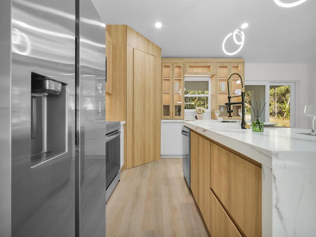 11790 Orange Road Ocklawaha, FL 32179 - Photo 6 of 21 a bathroom with a double vanity sink and mirror