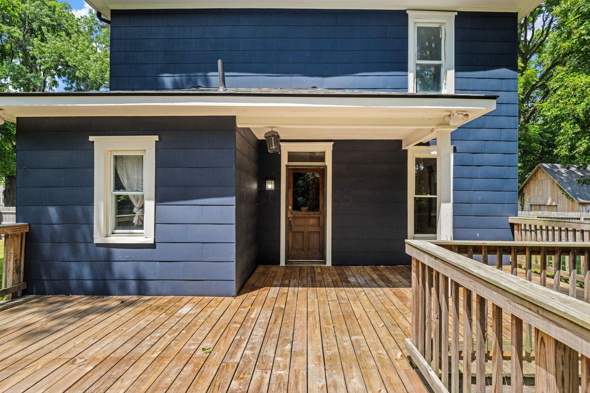 107 Price Road Columbus, OH 43230 - Photo 34 of 51 Expansive wood-finish deck with a wood railing system