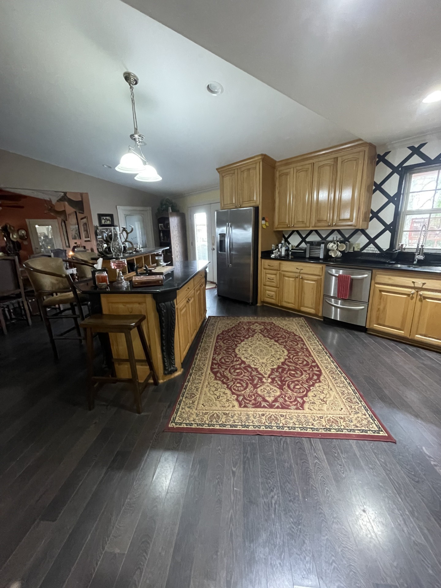 511 County Road 161 Long Branch, TX 75669 - Photo 12 of 32 a large kitchen with lots of counter space a sink a window and stainless steel appliances