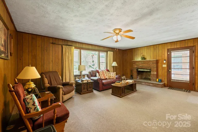 a living room with furniture and a fireplace