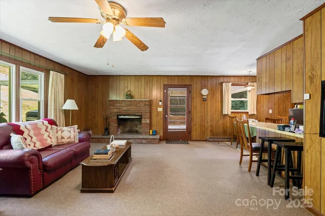 a view of room with window and ceiling fan