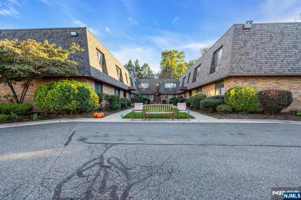 a front view of a building with garden