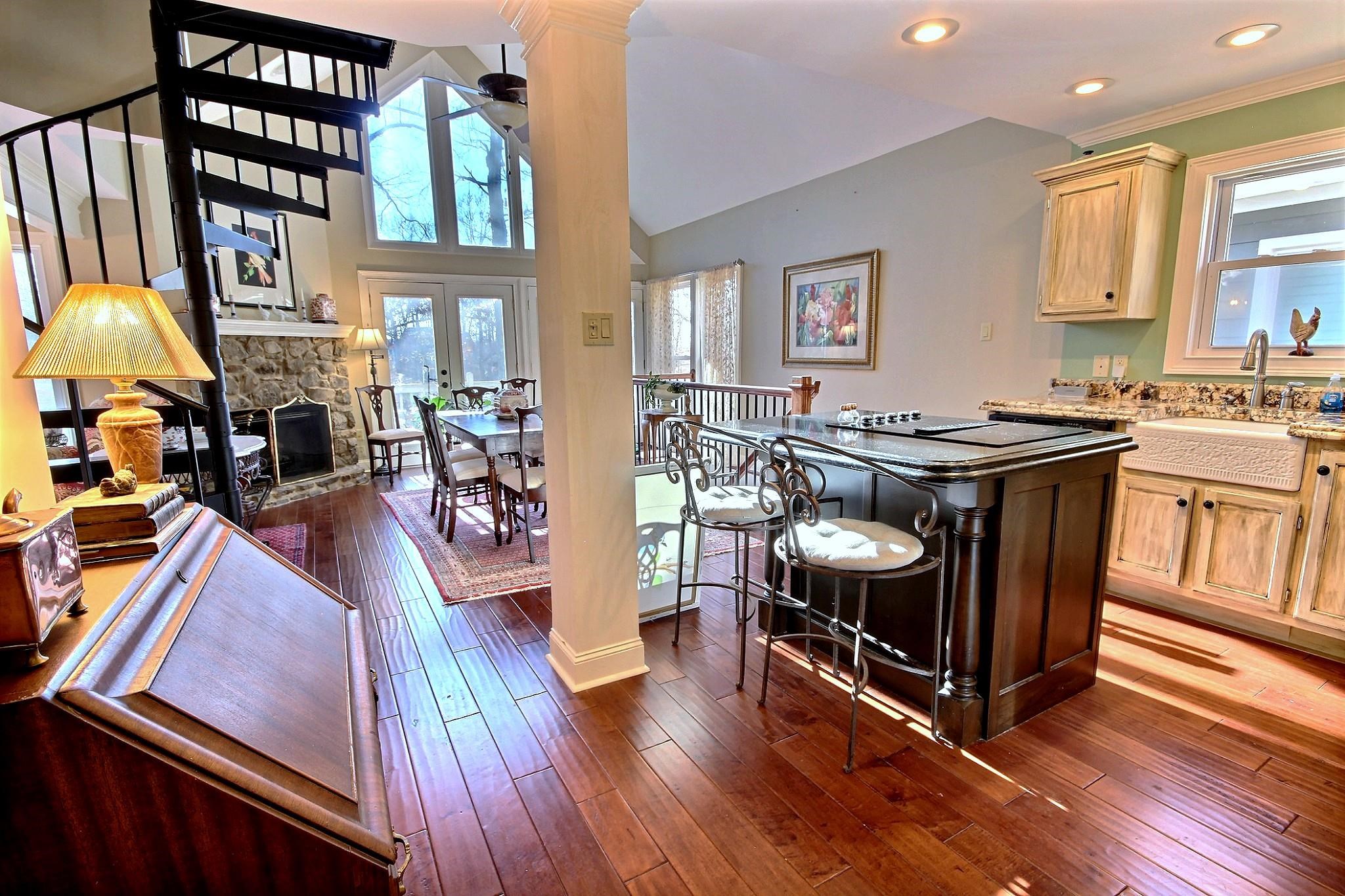 25 Dunhill Court Counce, TN 38326 - Photo 11 of 38 a kitchen with stainless steel appliances granite countertop a stove and a wooden floors