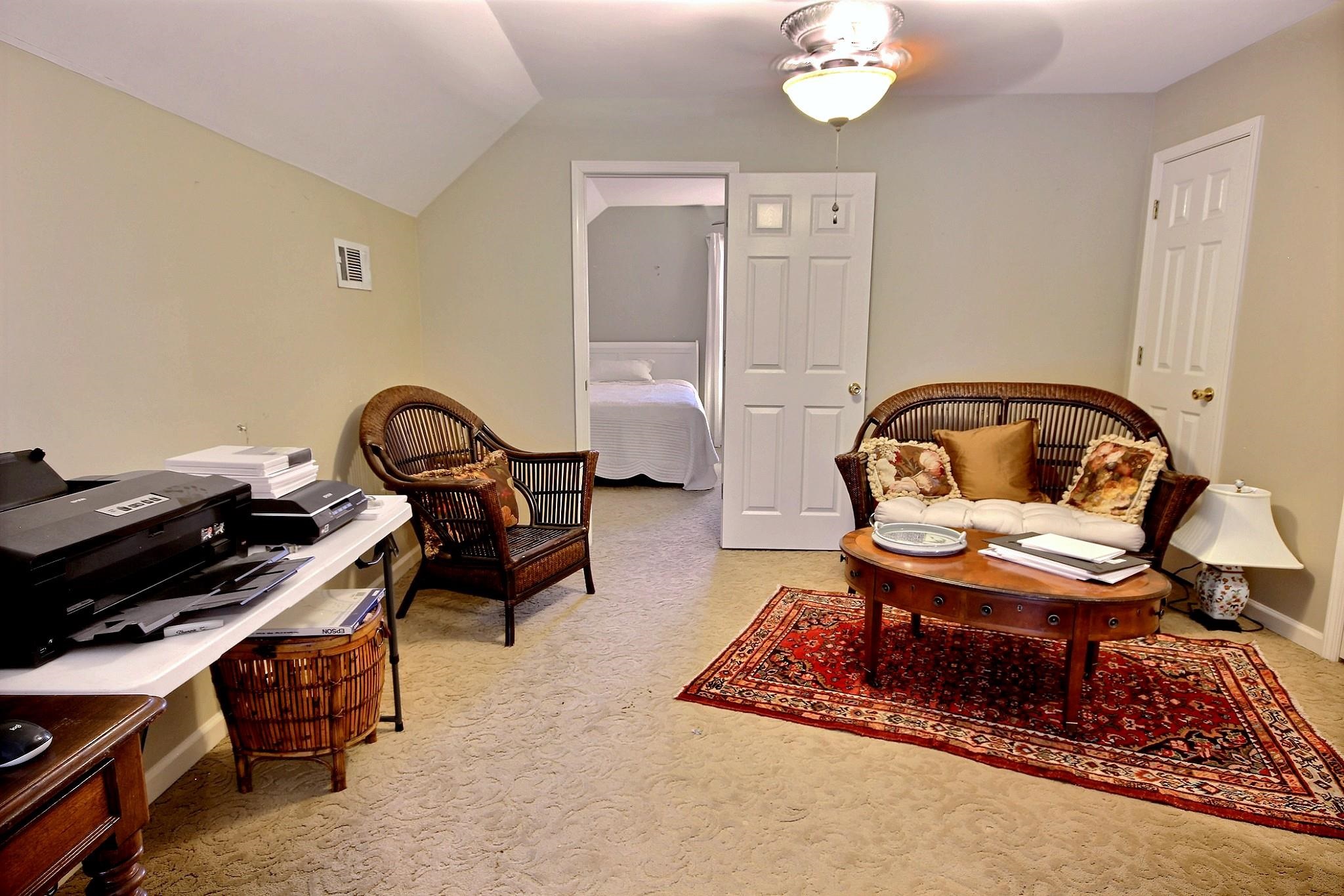 25 Dunhill Court Counce, TN 38326 - Photo 22 of 38 a living room with furniture a table and a chandelier