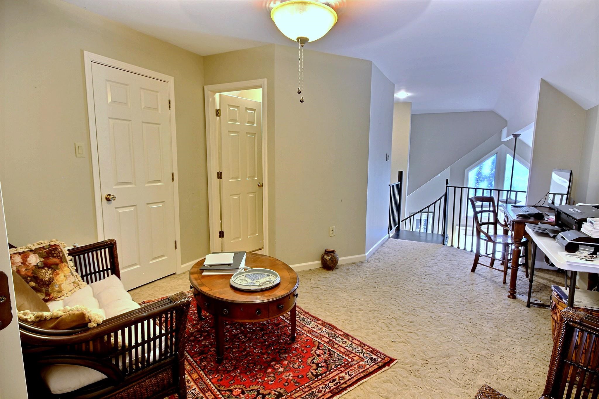 25 Dunhill Court Counce, TN 38326 - Photo 23 of 38 a living room with furniture a rug and a chandelier