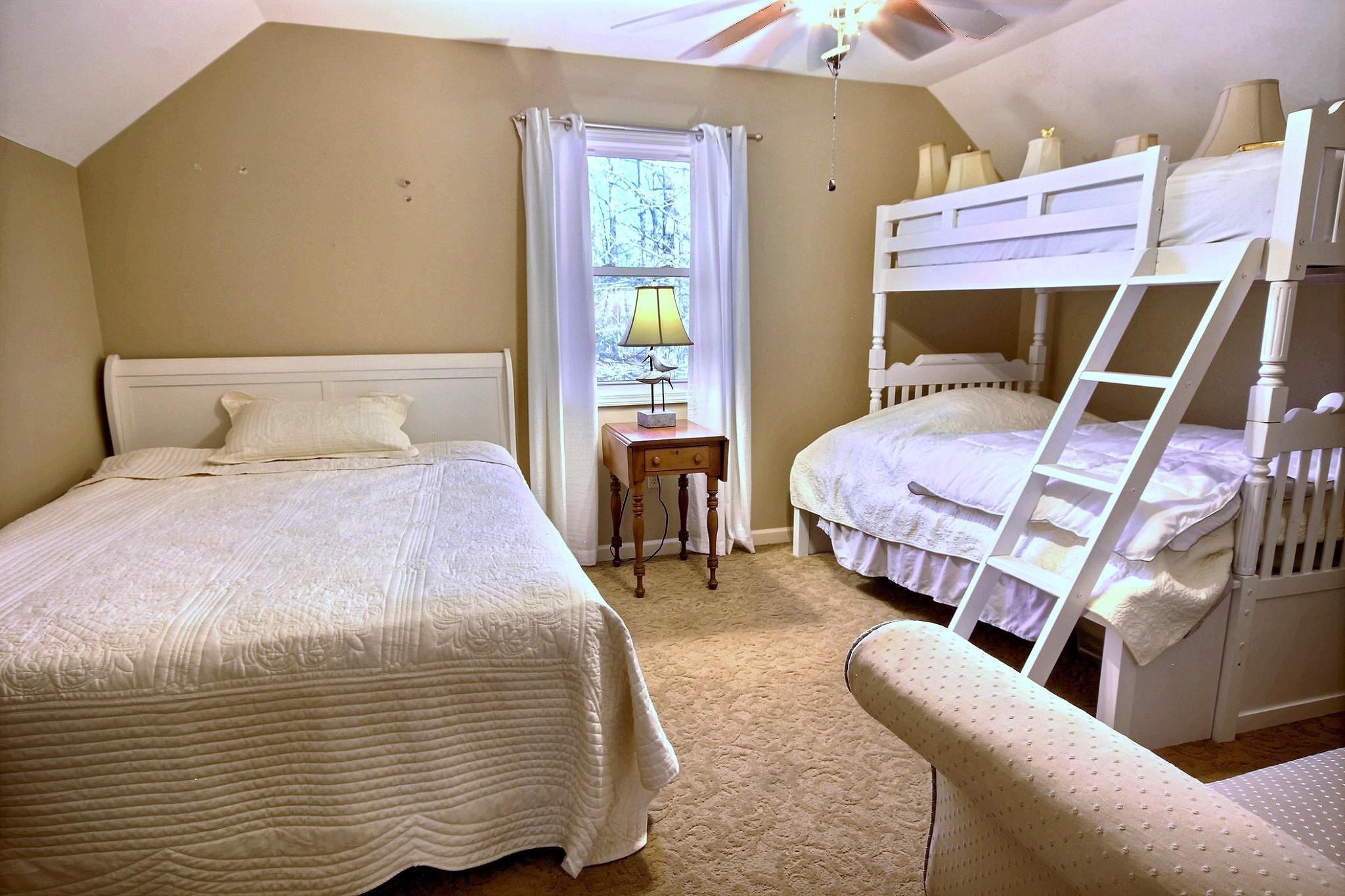 25 Dunhill Court Counce, TN 38326 - Photo 24 of 38 a bedroom with a bed and a chandelier