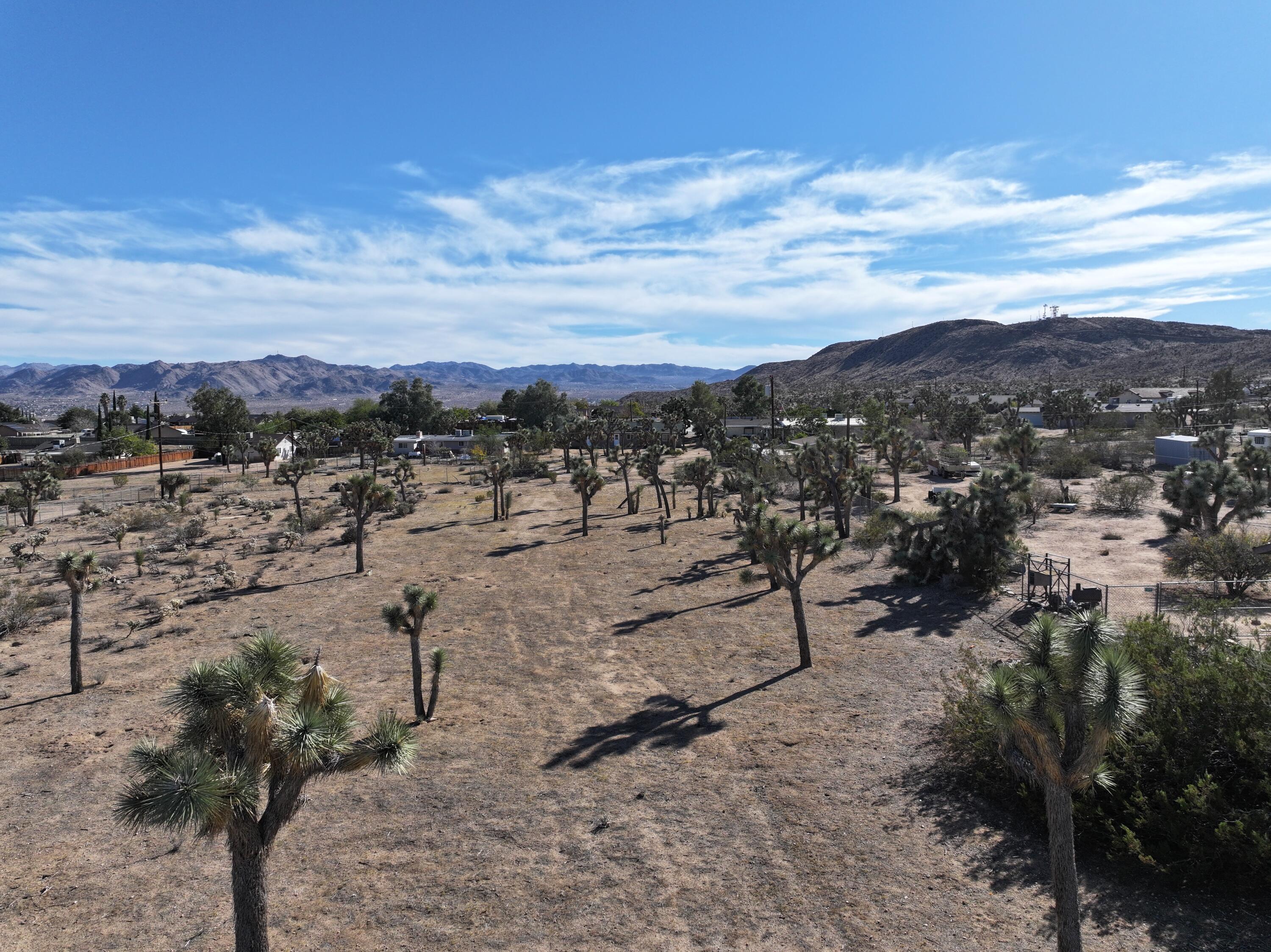 310 Sun Oro Road Yucca Valley, CA 92284 - Photo 3 of 20 a view of a lake with mountains in the background