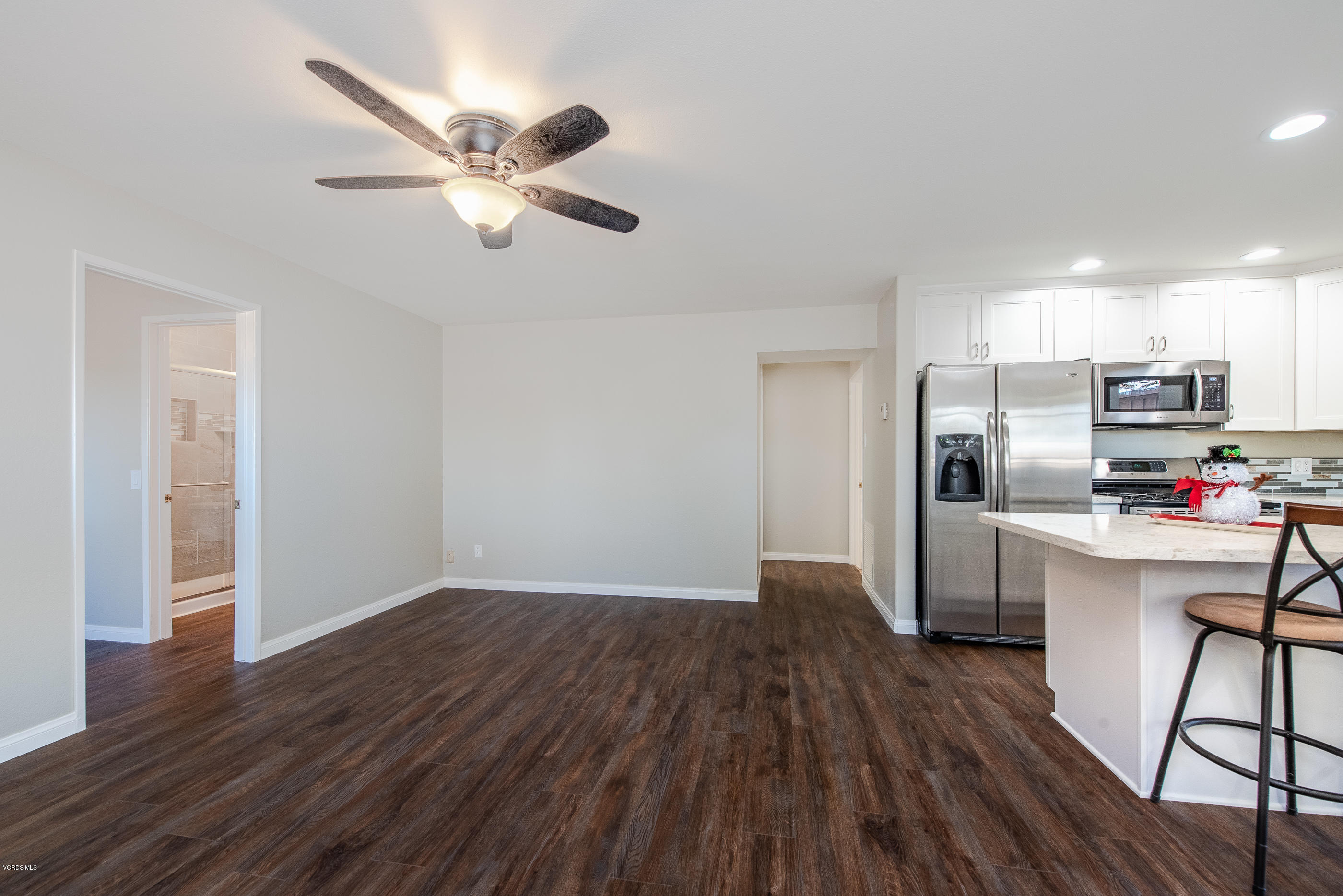 823 Katherine Road Simi Valley, CA 93063 - Photo 3 of 25 a view of a kitchen with wooden floor a sink a refrigerator and window