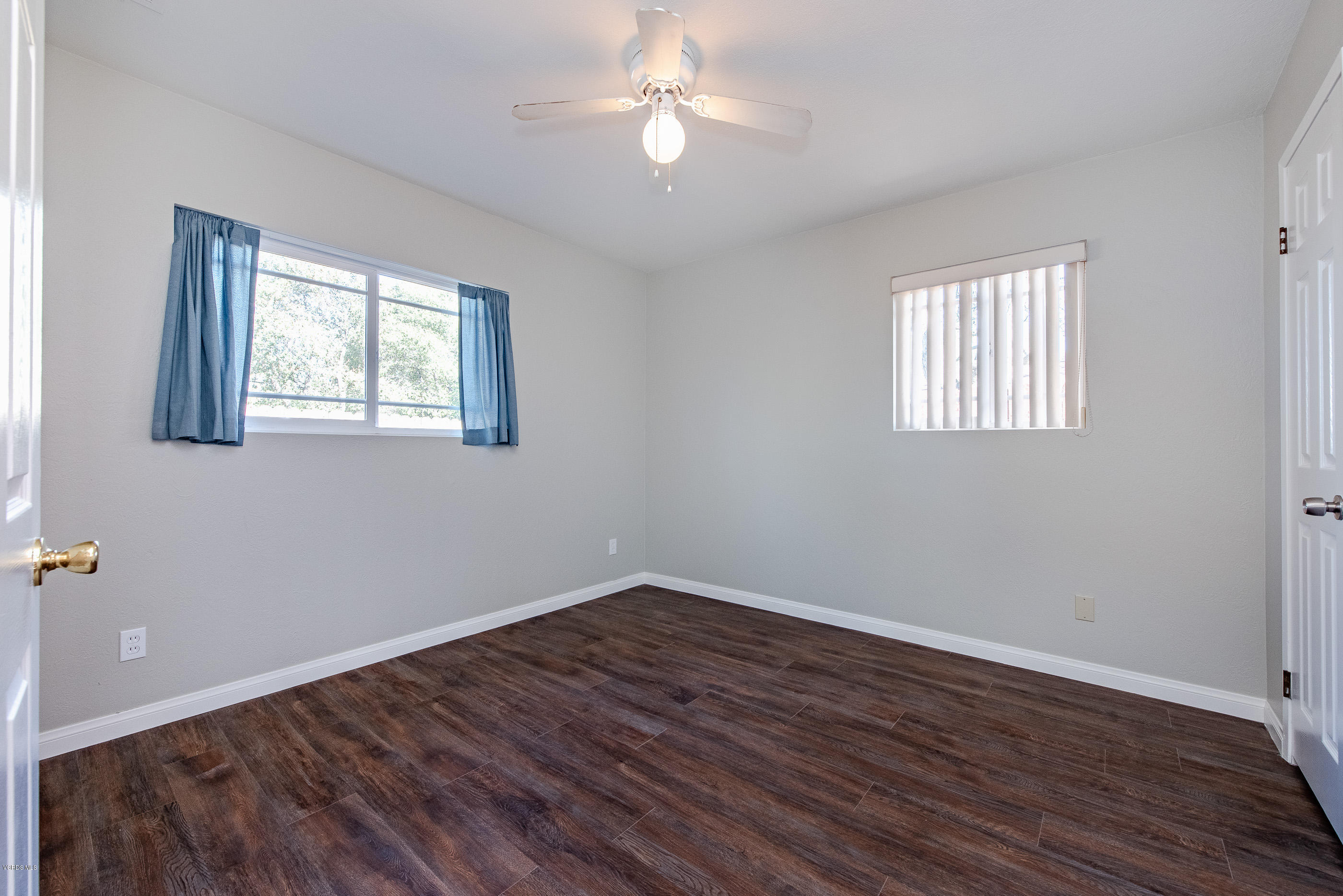 823 Katherine Road Simi Valley, CA 93063 - Photo 9 of 25 a view of empty room with wooden floor and fan