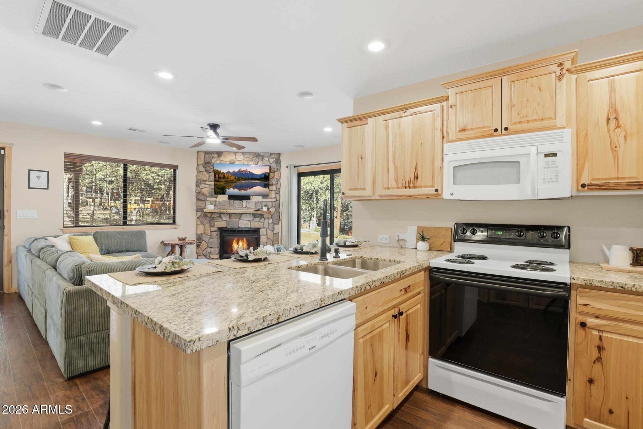 4023 Pine Road Pine, AZ 85544 - Photo 11 of 22 a kitchen with stainless steel appliances granite countertop a stove and a sink