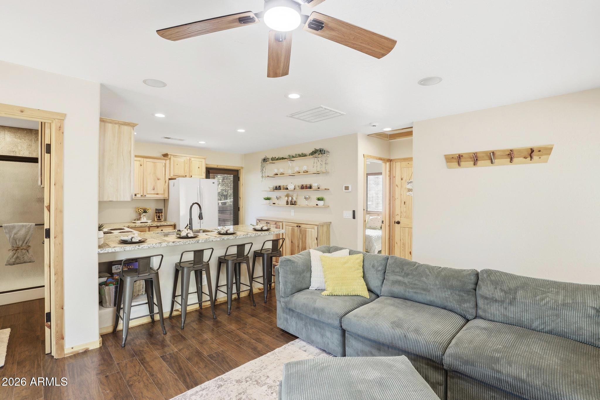 4023 Pine Road Pine, AZ 85544 - Photo 7 of 22 a living room with furniture kitchen view and a chandelier