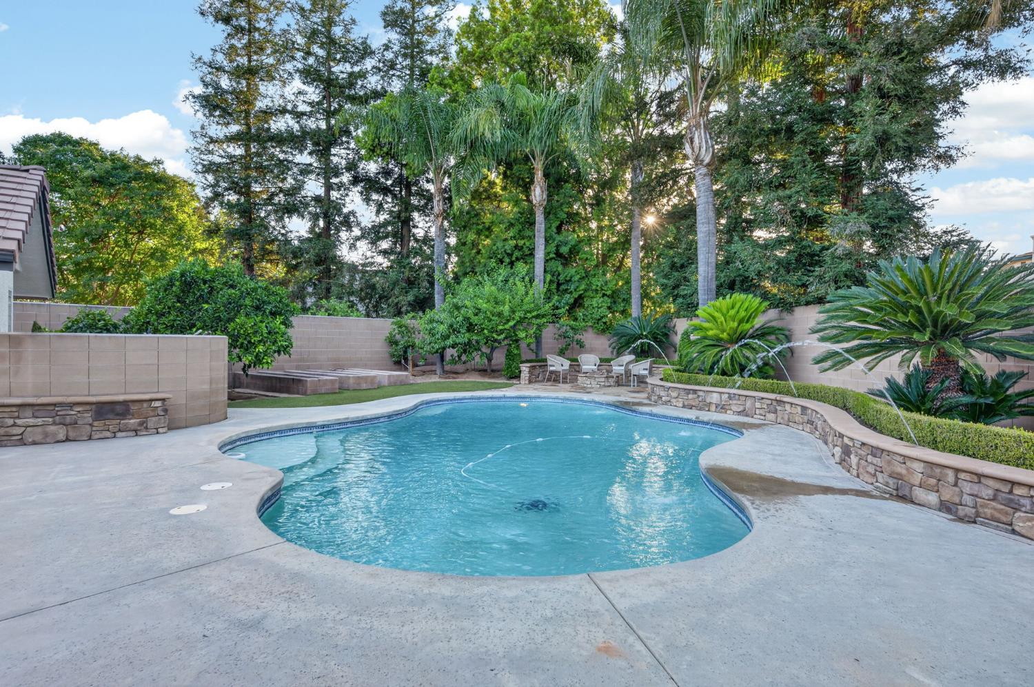 601 Decatur Avenue Clovis, CA 93611 - Photo 56 of 62 a view of a swimming pool with a sitting area