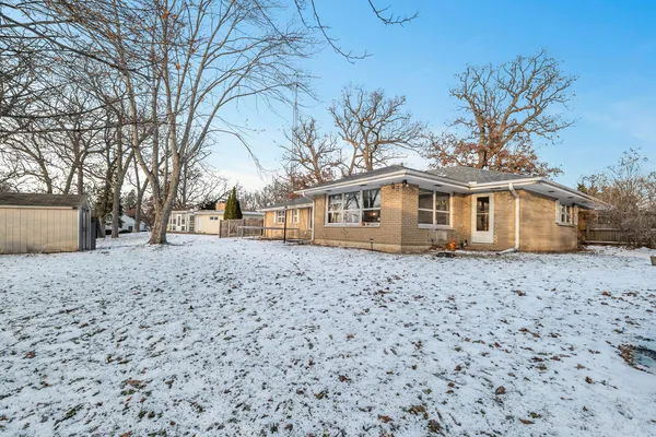a backyard of a house with large trees