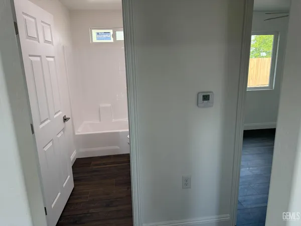 a bathroom with a bathtub and shower