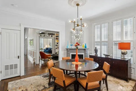 a kitchen with a table and chairs in it