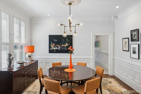 a kitchen with stainless steel appliances granite countertop wooden cabinets a stove and a sink