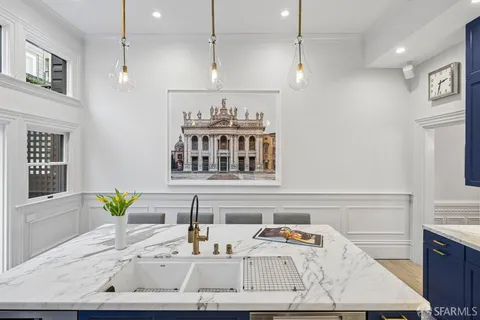 a view of a city from a dining room with furniture window and outside view