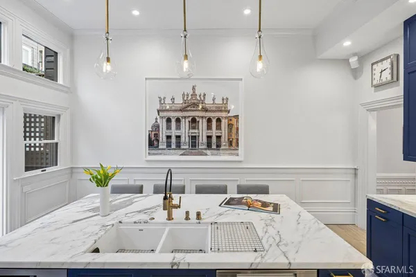 a living room with furniture a rug and a flat screen tv