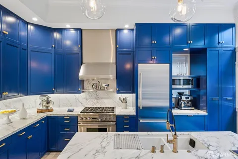 a view of staircase with wooden floor and white walls
