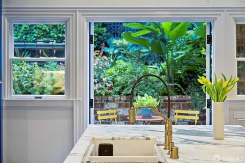 a bathroom with a double vanity sink mirror and shower