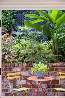 a bedroom with furniture and a window