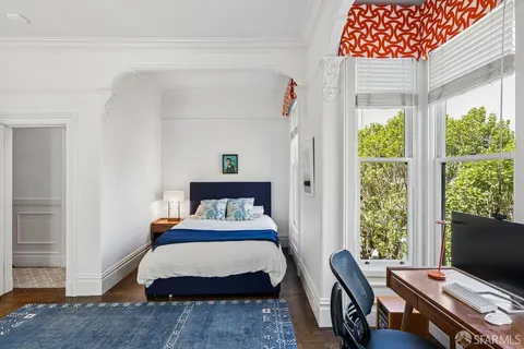 a living room with lots of furniture and a chandelier
