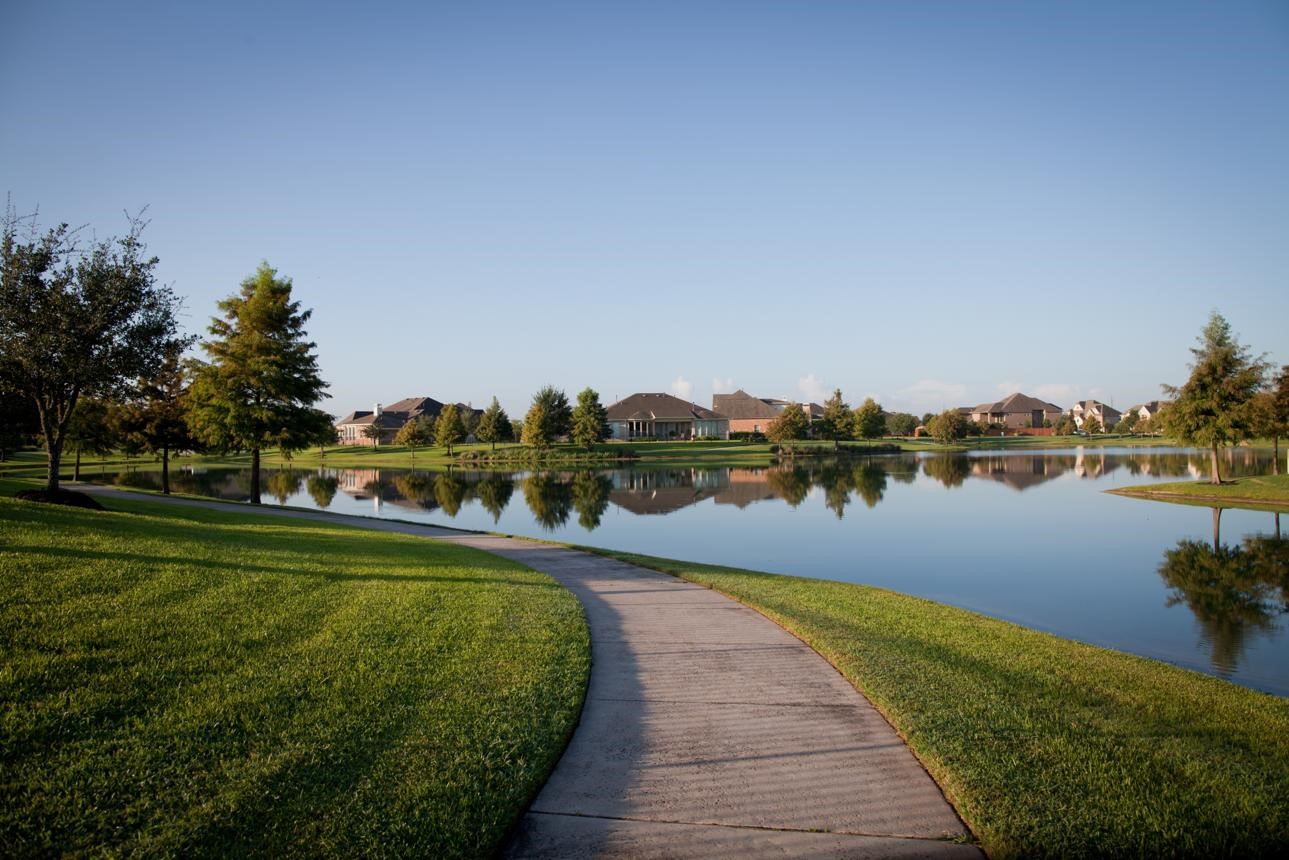 16403 Sun Valley Lane Rosharon, TX 77583 - Photo 9 of 15 a view of a lake with houses in the back