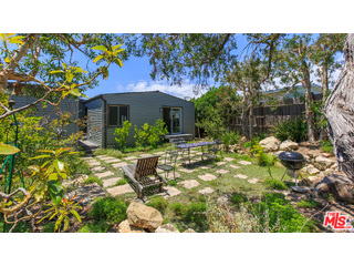 29500 Heathercliff Road, Unit 178 Malibu, CA 90265 - Photo 12 of 35 a picture of a house with a yard