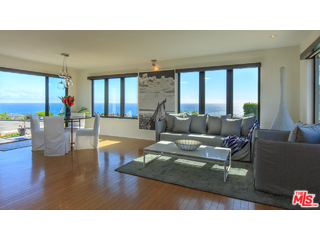 29500 Heathercliff Road, Unit 178 Malibu, CA 90265 - Photo 14 of 35 a living room with furniture and a large window