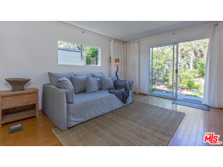 29500 Heathercliff Road, Unit 178 Malibu, CA 90265 - Photo 17 of 35 a living room with furniture and a large window