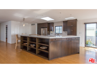 29500 Heathercliff Road, Unit 178 Malibu, CA 90265 - Photo 18 of 35 a kitchen with kitchen island a counter top space appliances and a window