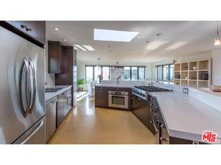 29500 Heathercliff Road, Unit 178 Malibu, CA 90265 - Photo 19 of 35 a kitchen with stainless steel appliances kitchen island granite countertop a refrigerator and a sink