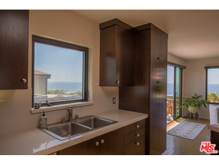 29500 Heathercliff Road, Unit 178 Malibu, CA 90265 - Photo 23 of 35 a bathroom with a sink and a mirror