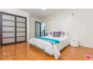 29500 Heathercliff Road, Unit 178 Malibu, CA 90265 - Photo 31 of 35 a bedroom with a bed and a window