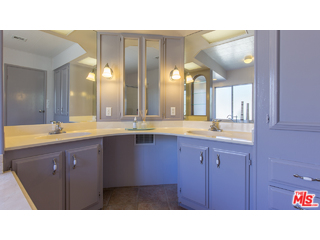 29500 Heathercliff Road, Unit 178 Malibu, CA 90265 - Photo 32 of 35 a bathroom with a sink a mirror and a double vanity