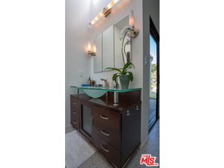 29500 Heathercliff Road, Unit 178 Malibu, CA 90265 - Photo 34 of 35 a bathroom with a sink and a mirror
