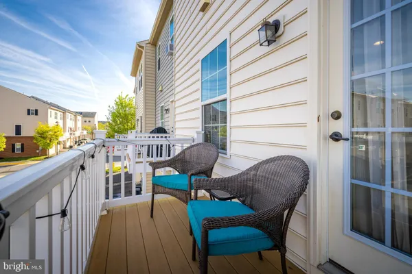 a view of a deck with furniture