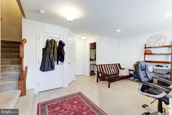 a bedroom with furniture and a window