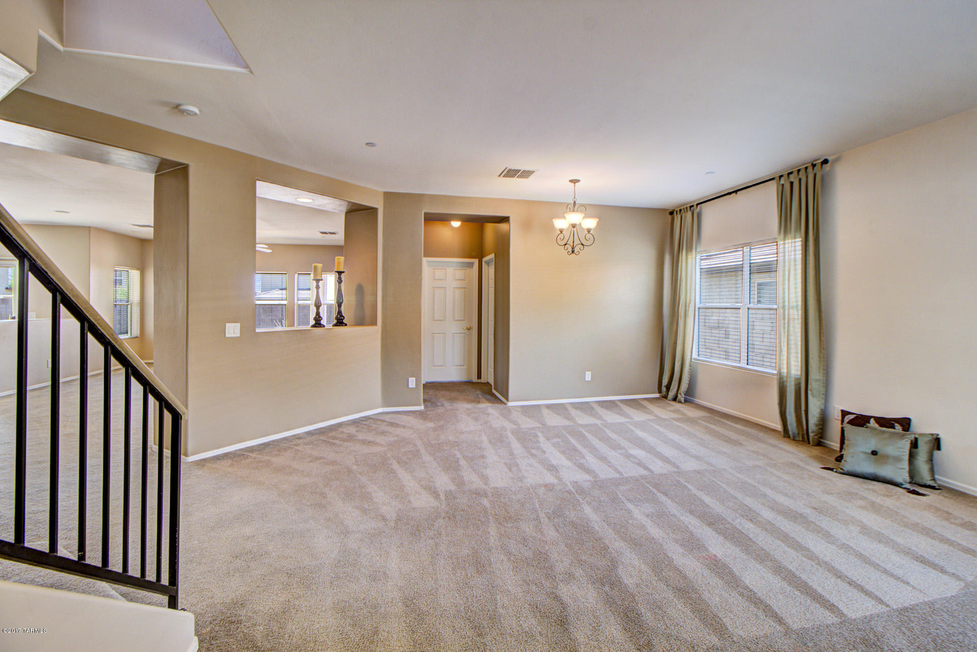3588 East Mecate Road Tucson, AZ 85739 - Photo 4 of 36 wooden floor in an empty room with a window