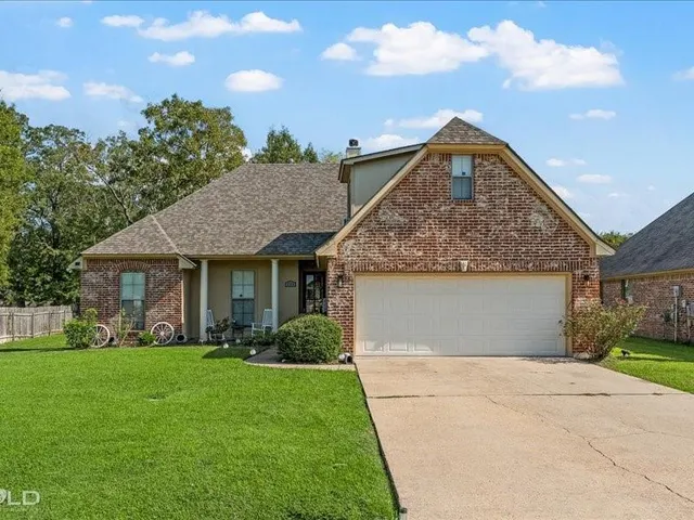 a front view of house with garden