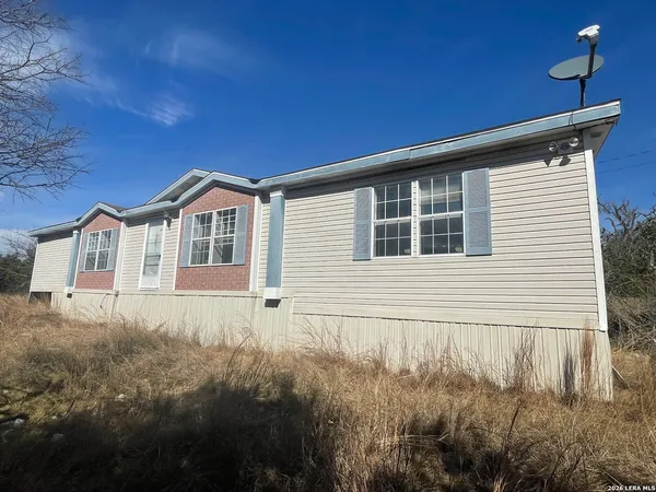 a house view with a backyard space