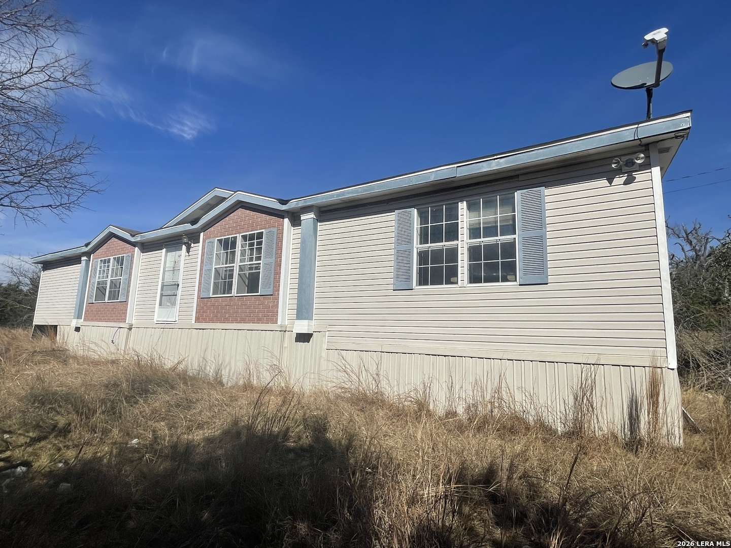 a house view with a backyard space
