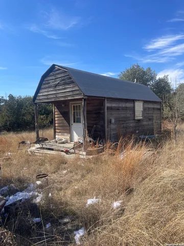a living room with furniture a window and a chandelier