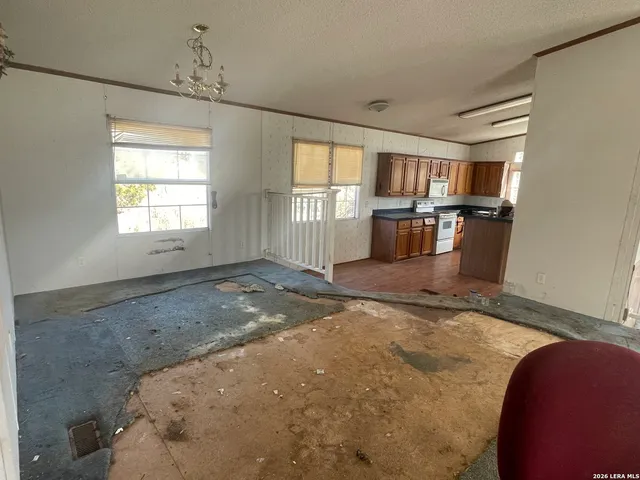 a room with gym equipment and windows