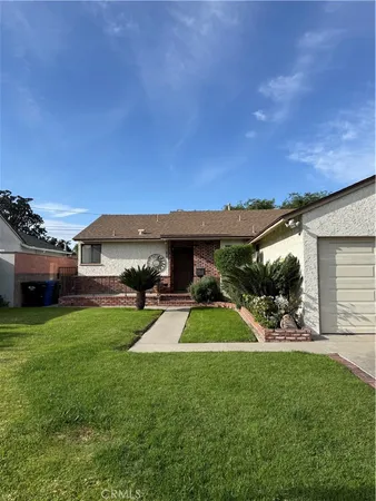 a view of a backyard of the house