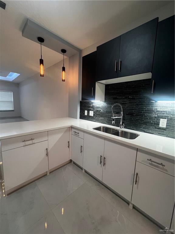 2204 North Jackson Road, Unit A B Edinburg, TX 78541 - Photo 10 of 18 a kitchen with a sink and cabinets