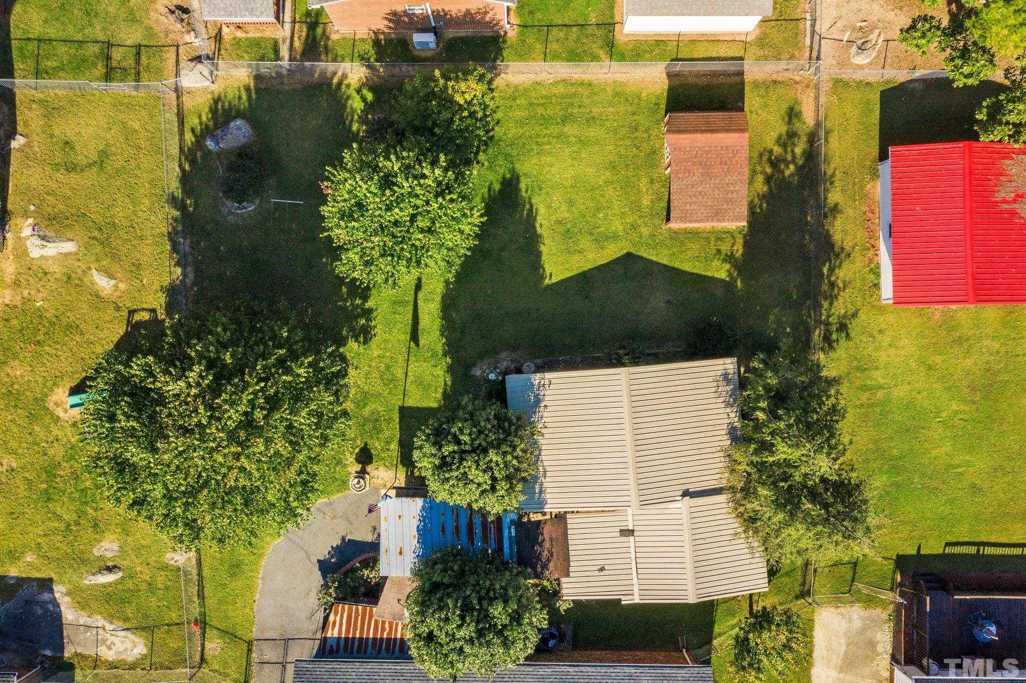 1211 Dover Street Roxboro, NC 27573 - Photo 9 of 35 an aerial view of residential houses with outdoor space