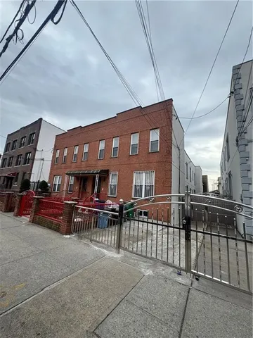 a view of a house with wooden deck