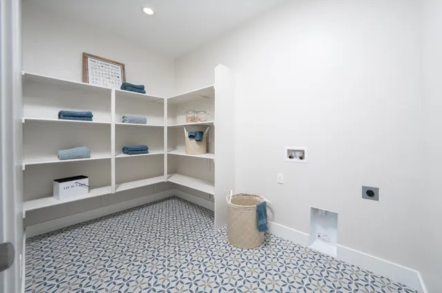 a view of a room with a potted plant and a rug